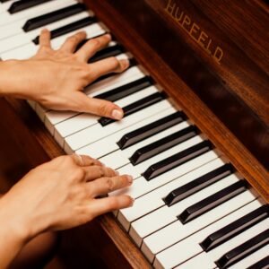close up photo of person playing piano